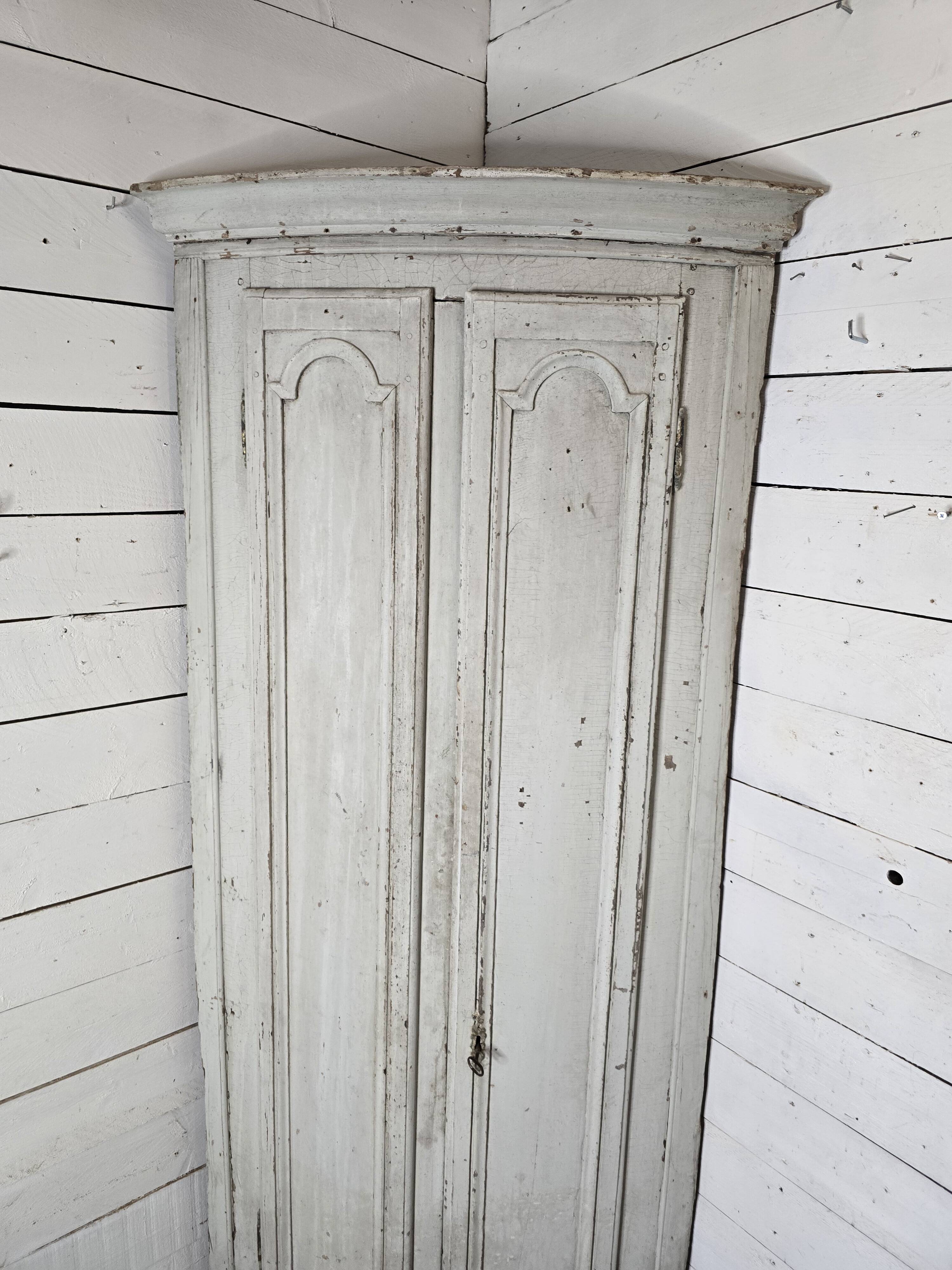 19th century curved corner cupboard in patinated oak