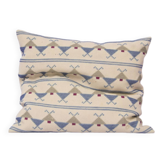Vintage beige embroidered cushion blue motif