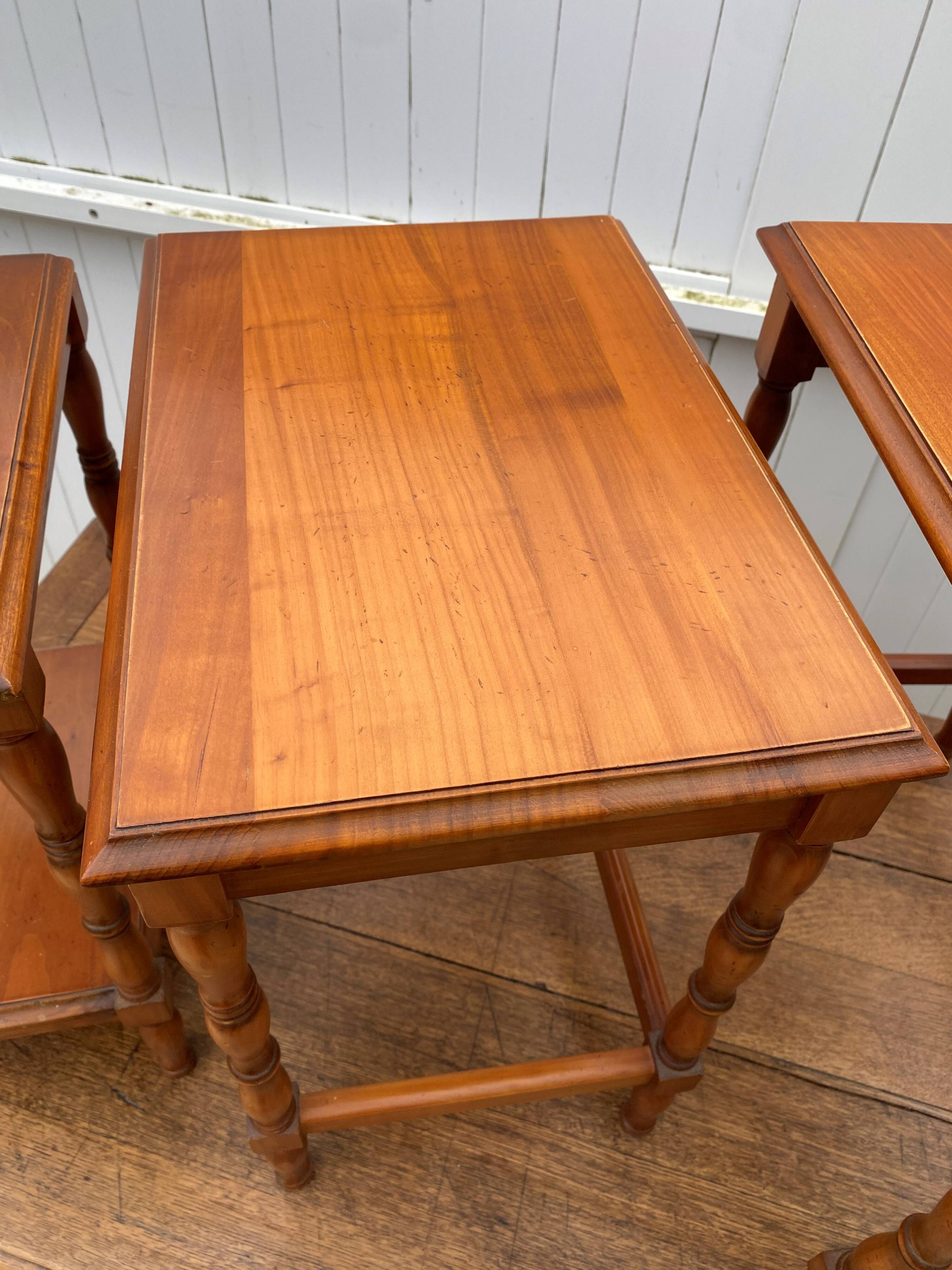 Set of 3 rustic cherry wood nesting coffee tables from the 1950s.