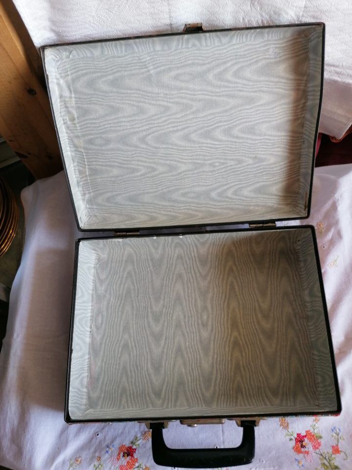 Old suitcase, red cashmere fabric, bohemian folk