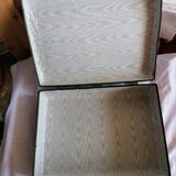 Old suitcase, red cashmere fabric, bohemian folk