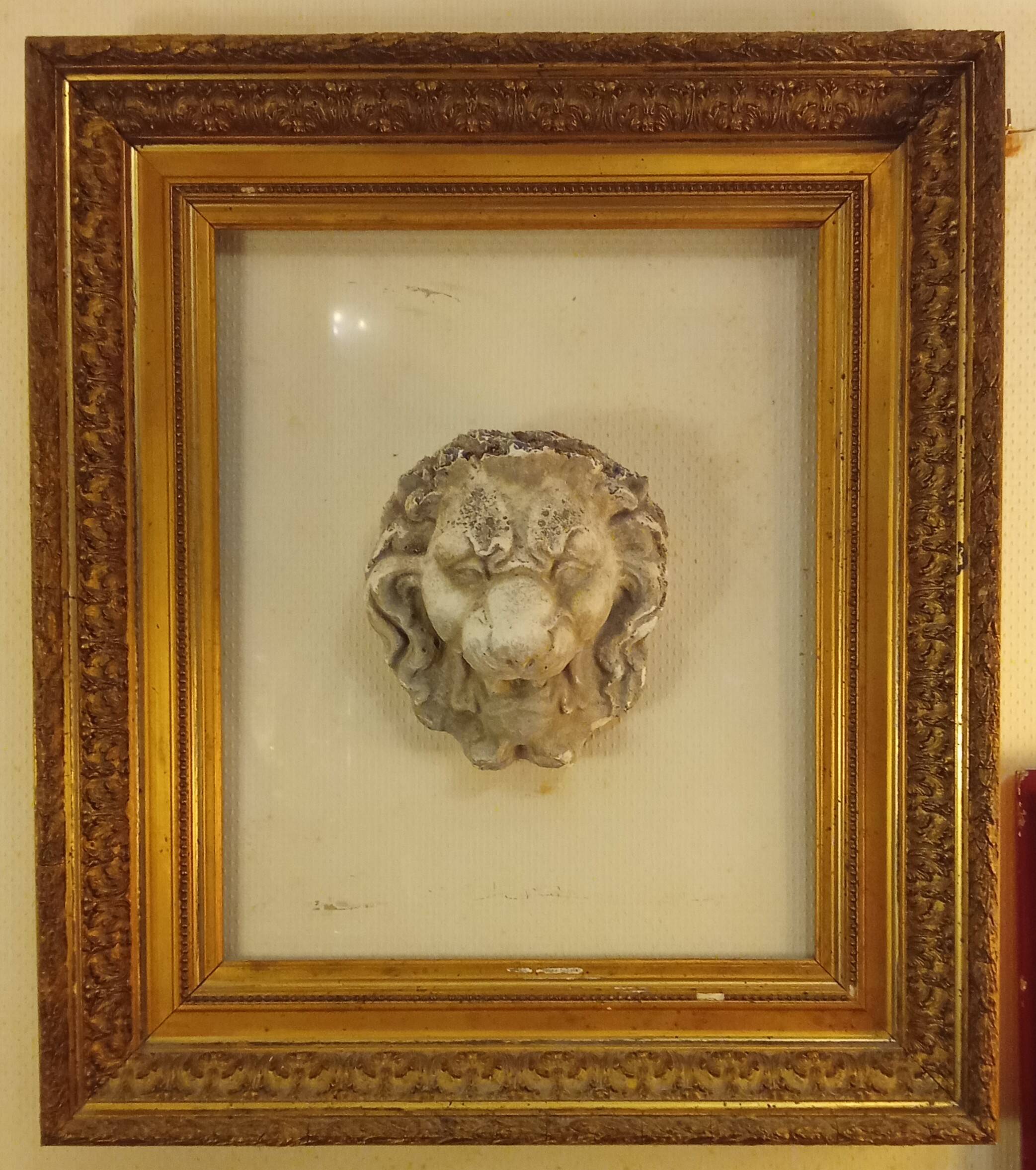 Antique large gilded frame with lion head ornament on plexiglass