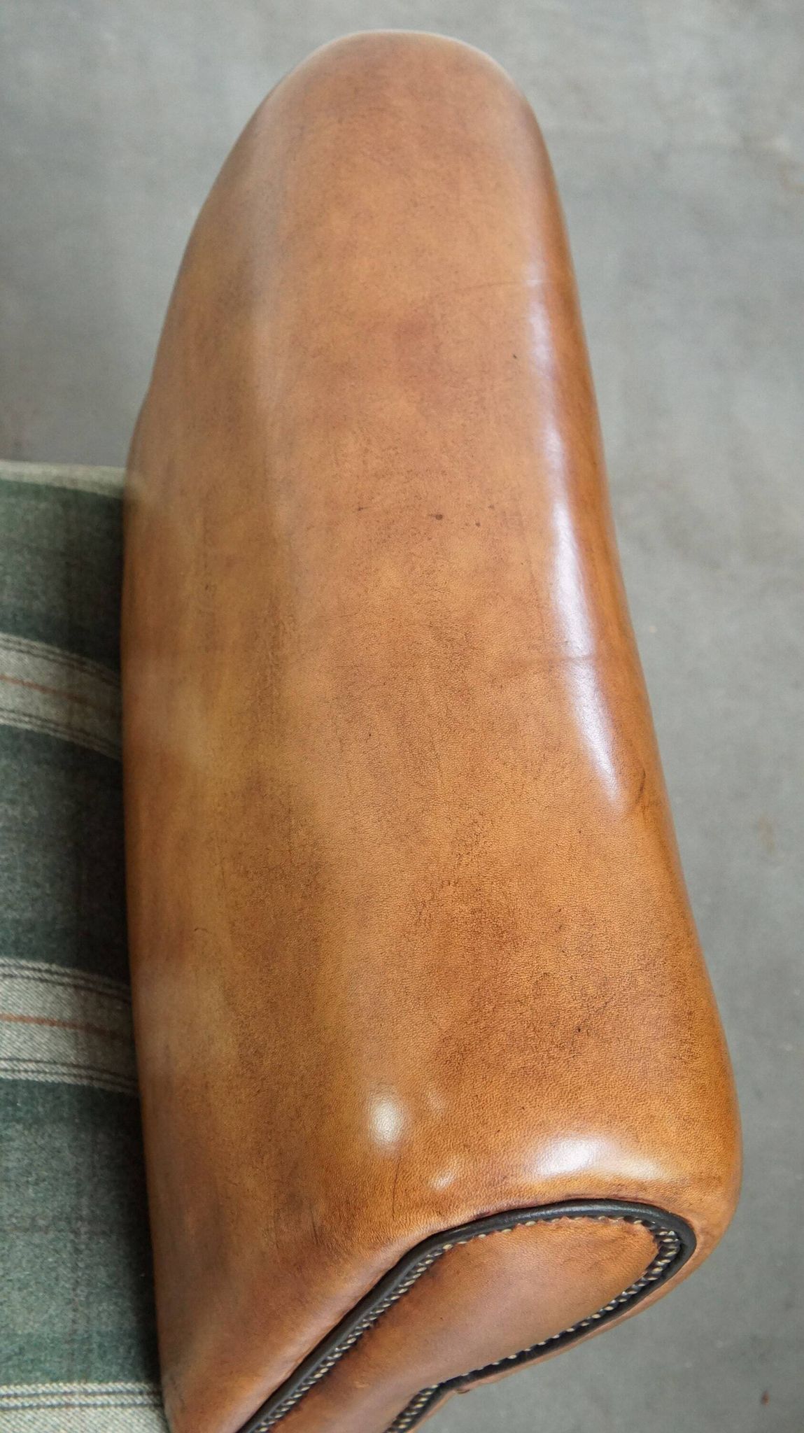Antique daybed reupholstered with sheepskin and Scottish tartan wool
