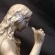 Statuette of a woman in gilded cast iron (Joan of Arc?)