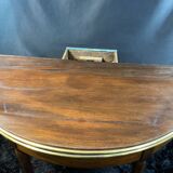 A Louis XVI period mahogany half-moon table forming a console/games table