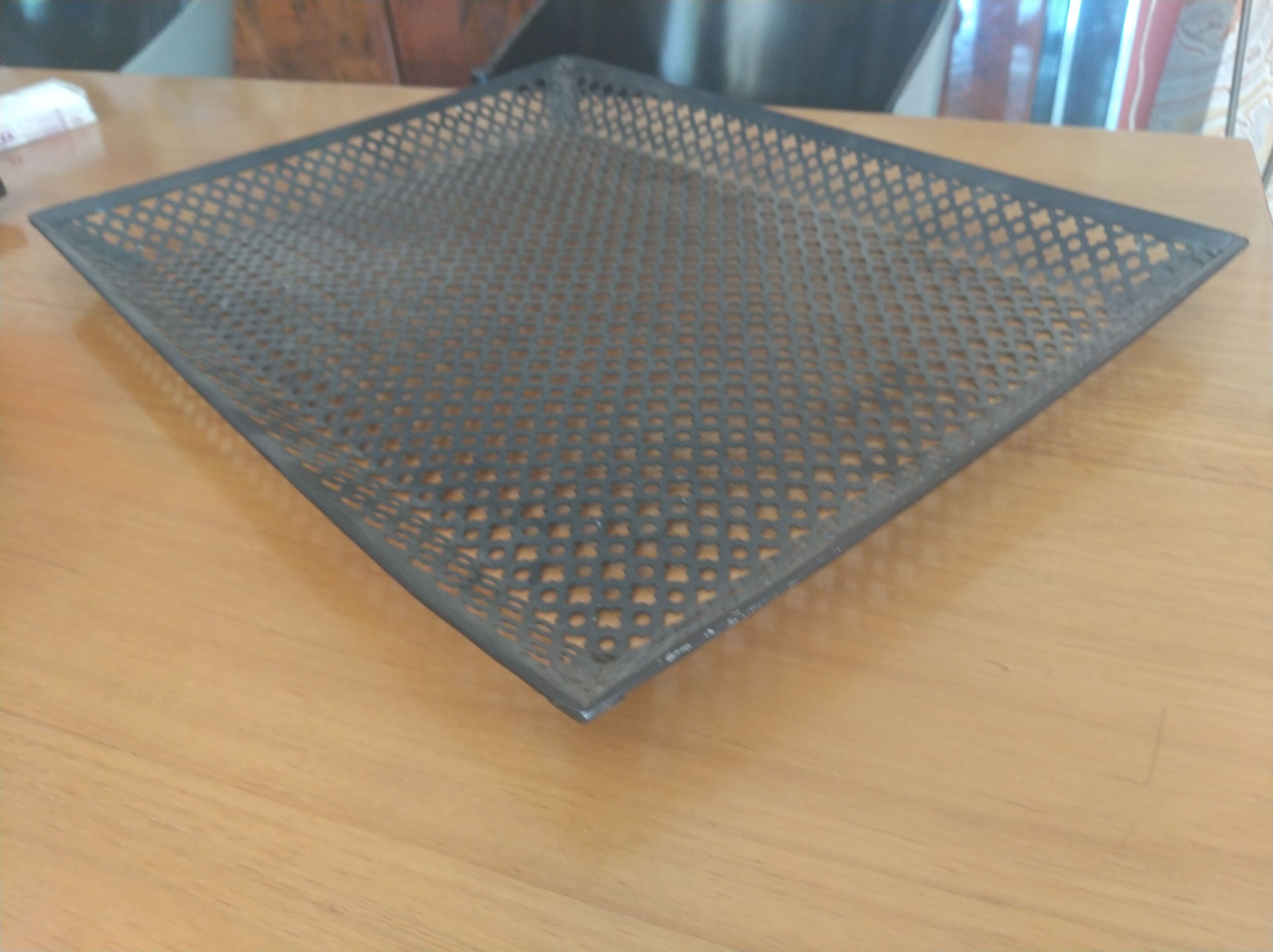 Perforated sheet metal tray, circa 1950