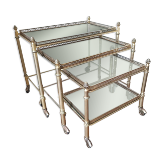 Gilded metal and smoked glass pull out tables