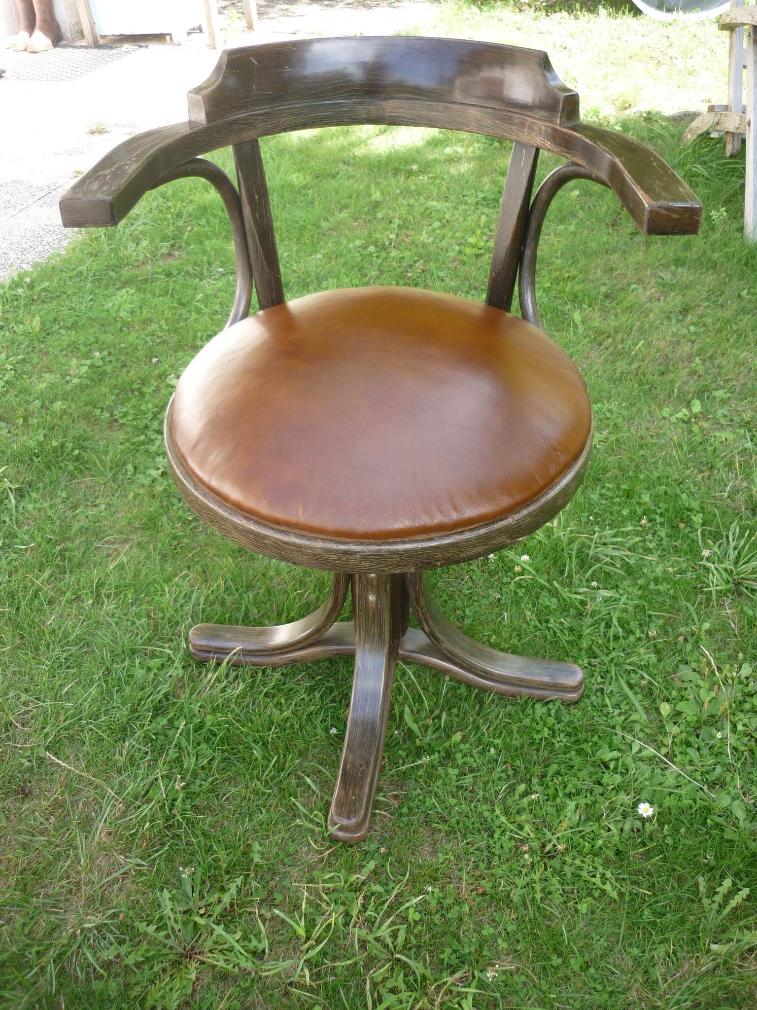 Swivel leather armchair