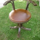 Swivel leather armchair