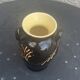 Vintage hand-painted yellow and black glazed ceramic amphora vase