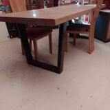 Modern table with metal legs and a natural varnished solid oak top