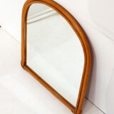 Rounded wall mirror in rattan 35x45cm