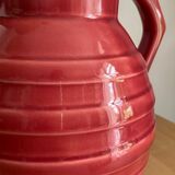 Raspberry-colored enamelled pitcher