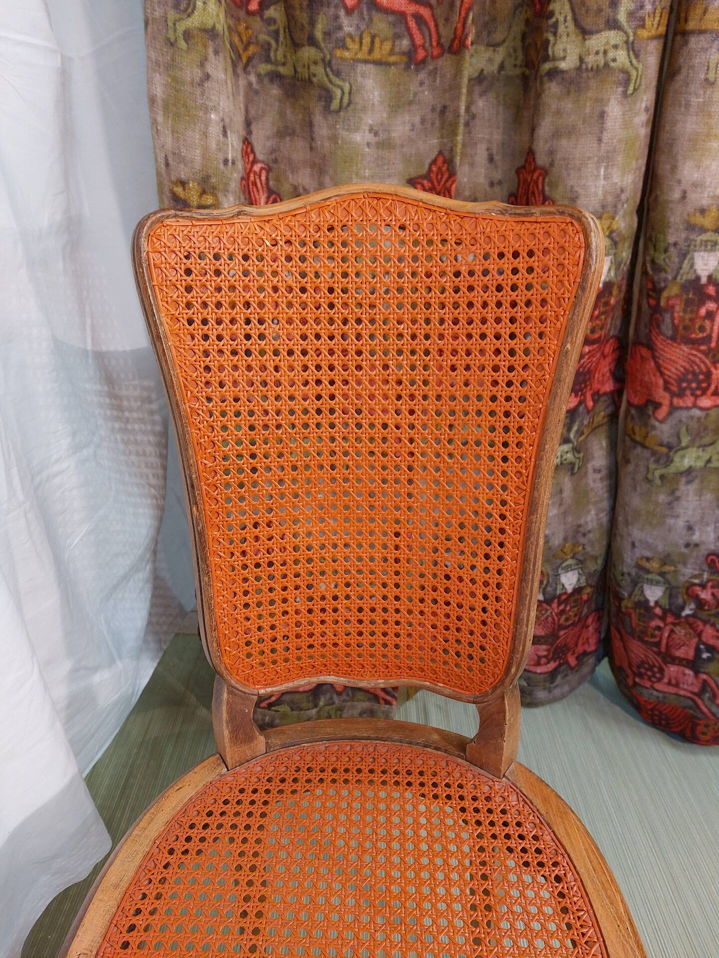 Caned chair in Louis XV style painted orange.