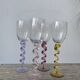 4 large, multicoloured, twisted champagne flutes