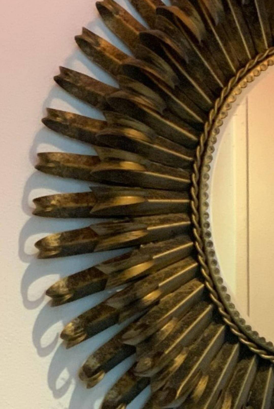 Golden iron star-shaped mirror, mid-1900s.