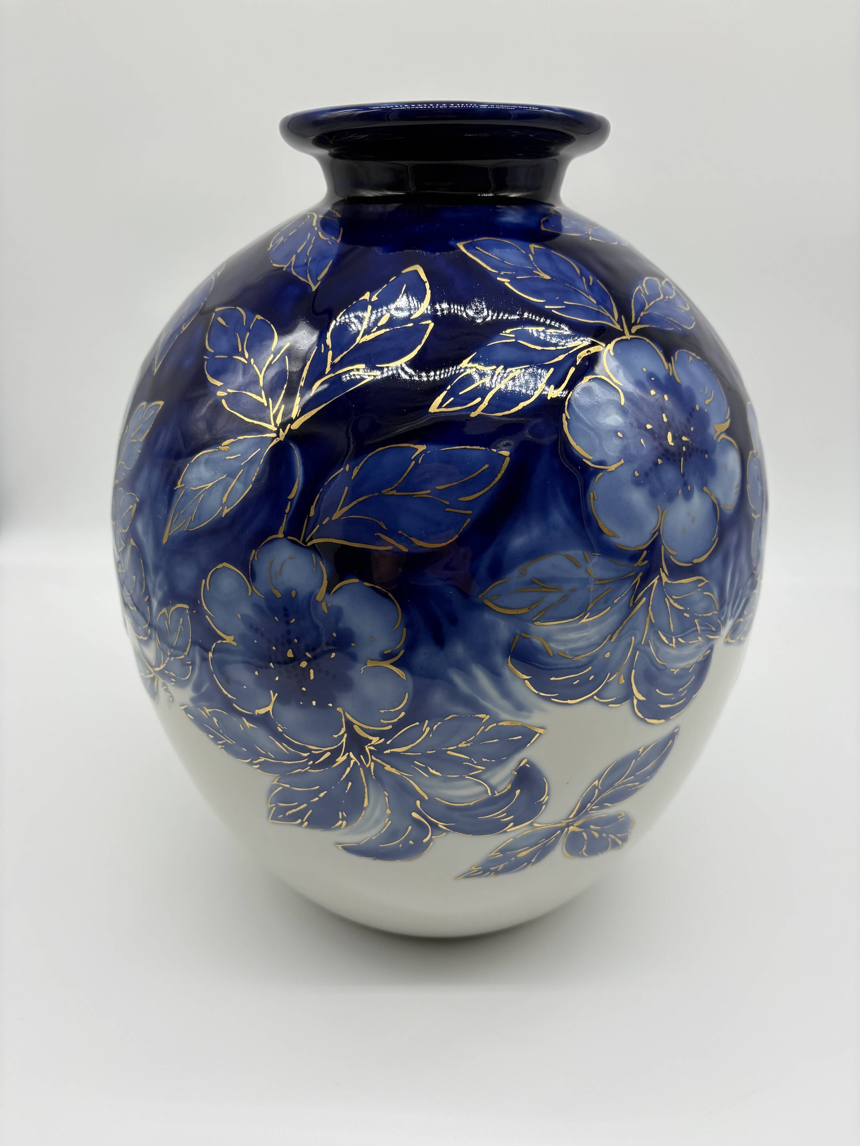 Large Tharaud Limoges vase in cobalt blue porcelain with floral decoration.