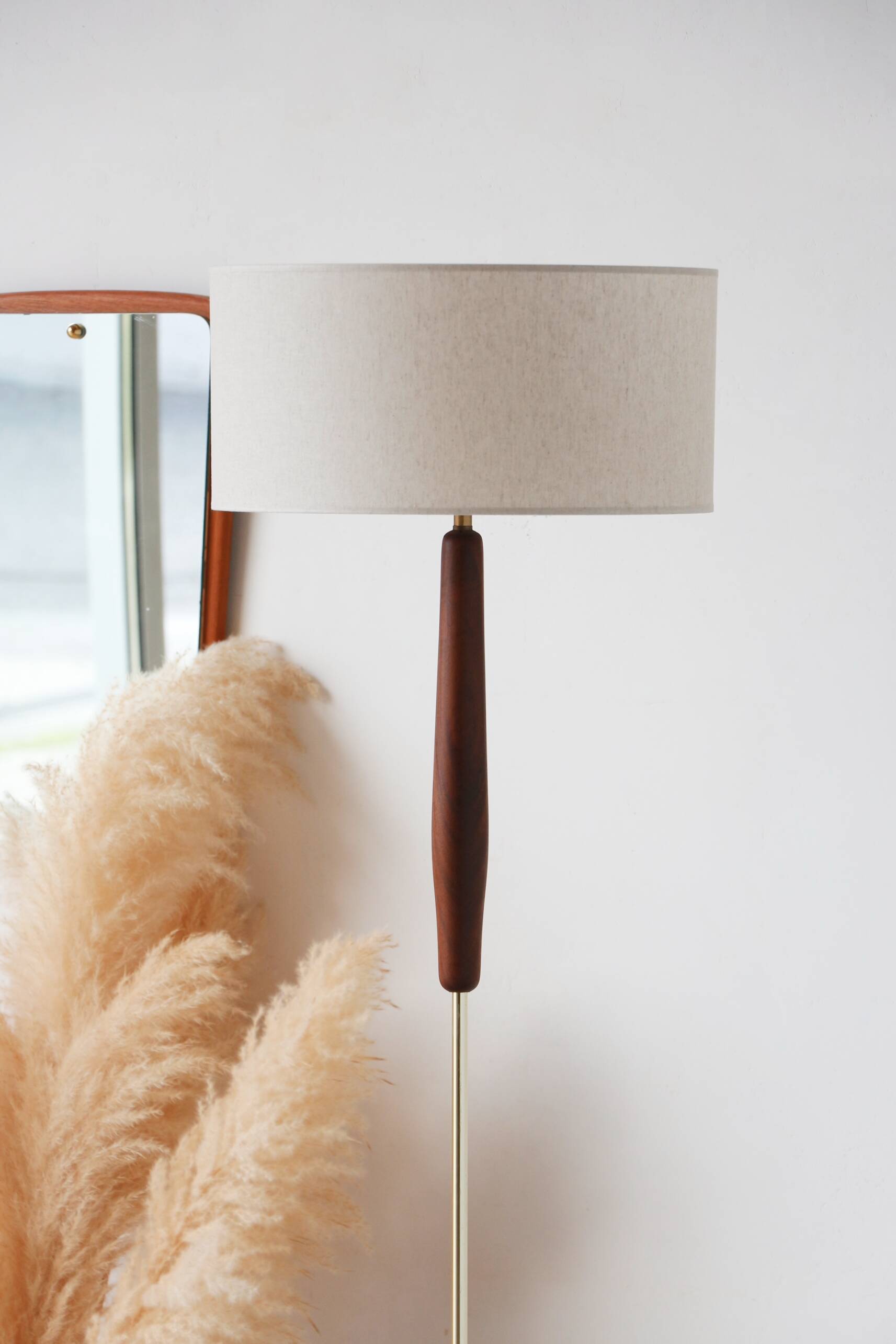 Vintage floor lamp in teak and brass with a cream shade.