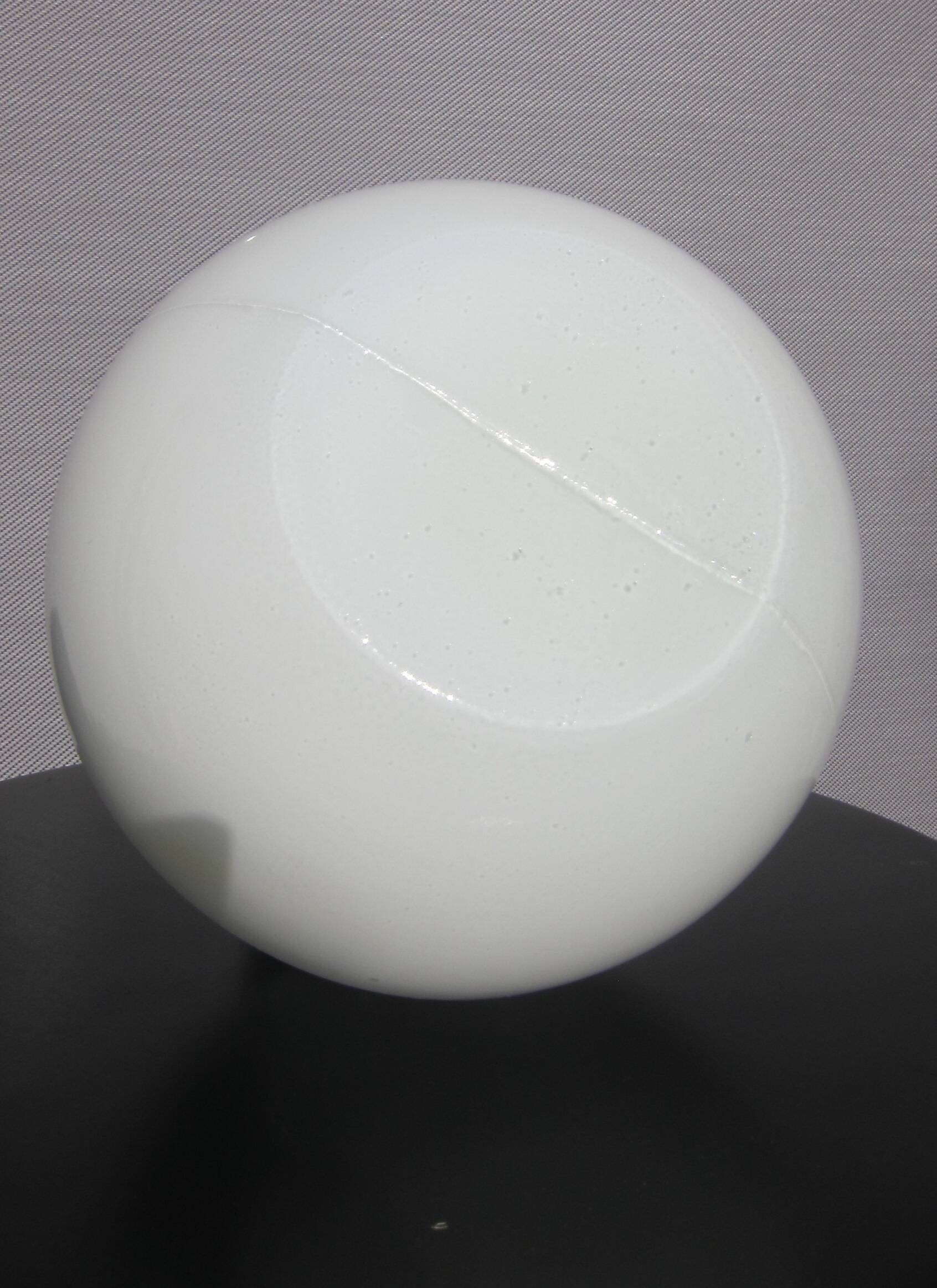 Trio of opal glass and bakelite globe pendant lights