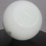 Trio of opal glass and bakelite globe pendant lights