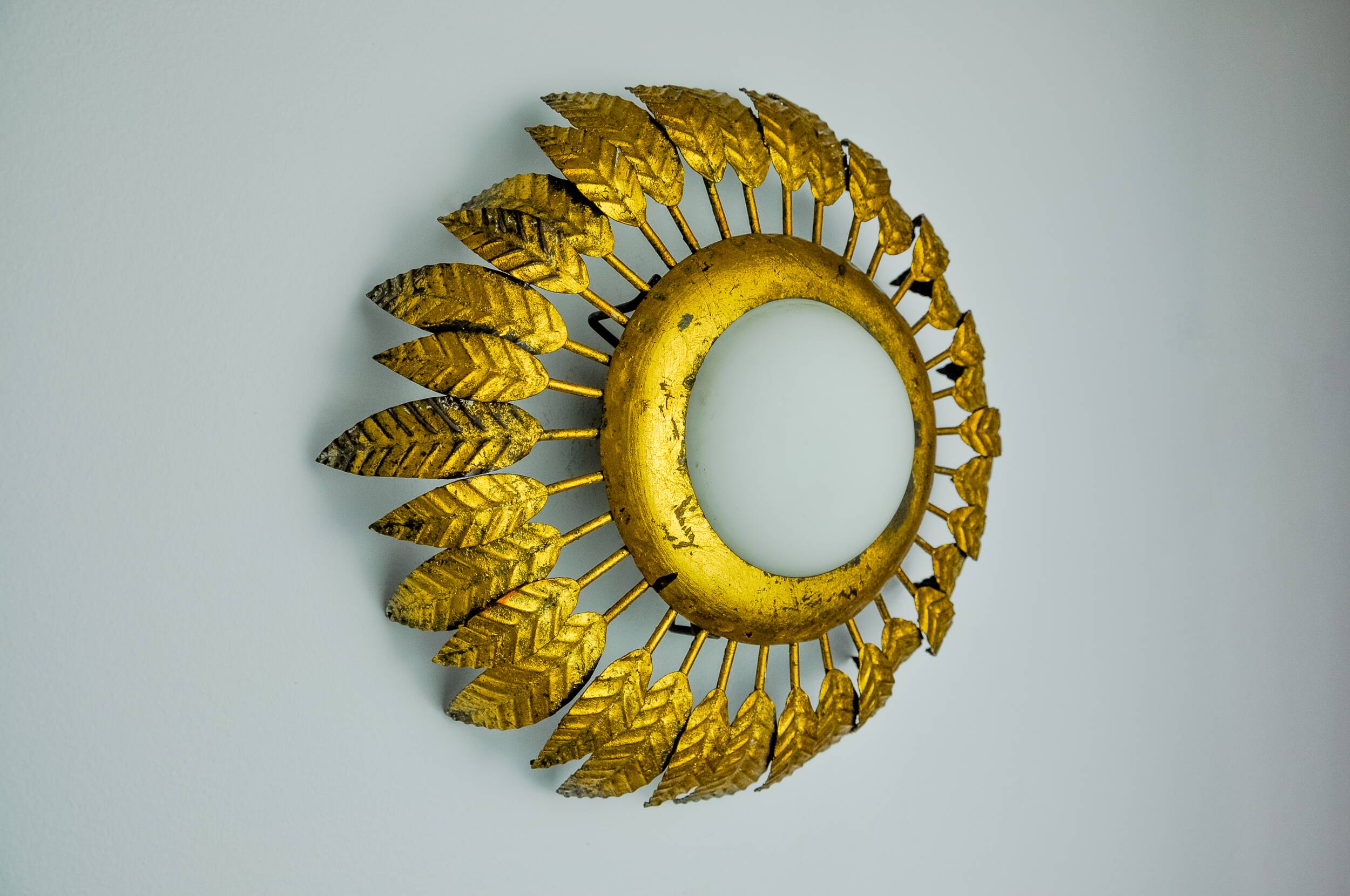 Sun wall lamp by ferro arte, metal and gold leaf and opaline glass, Spain, 1960