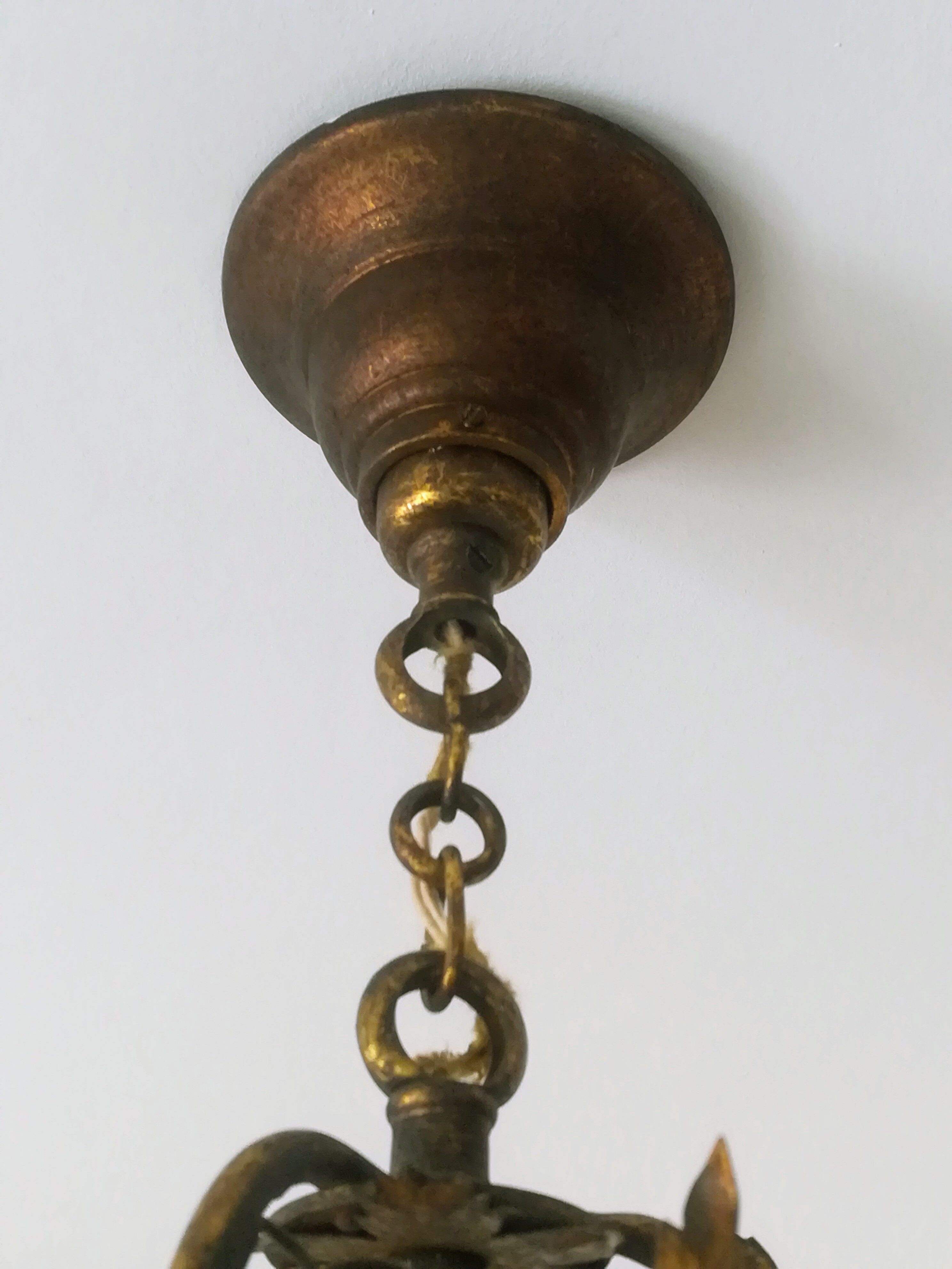 Brass chandelier and porcelain flowers