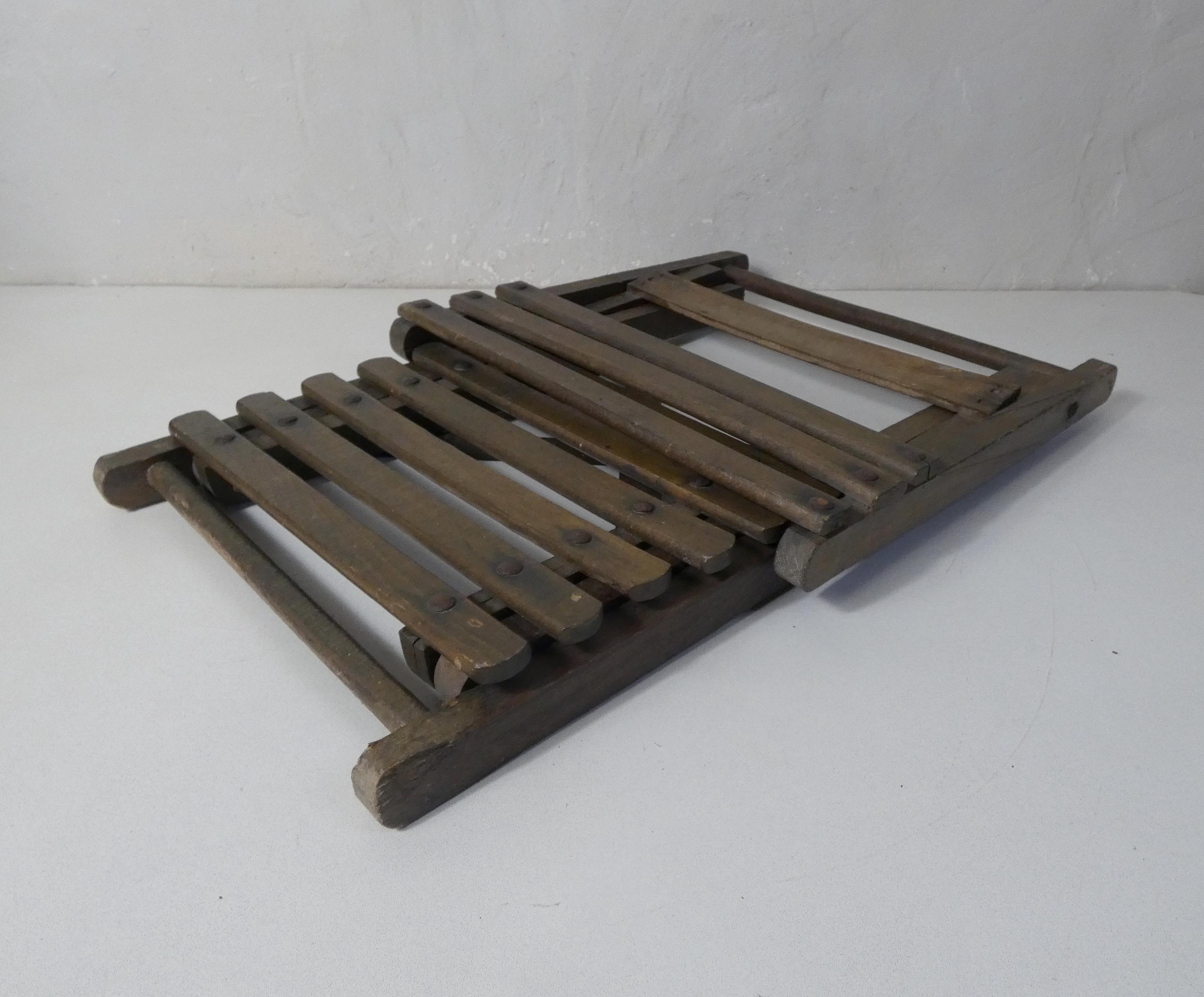 Old folding wooden chair for children