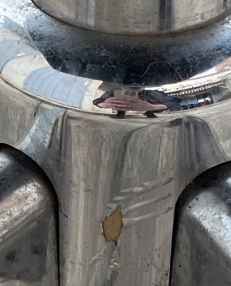 Black mottled fabric and chrome swivel armchair, 1