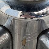 Black mottled fabric and chrome swivel armchair, 1