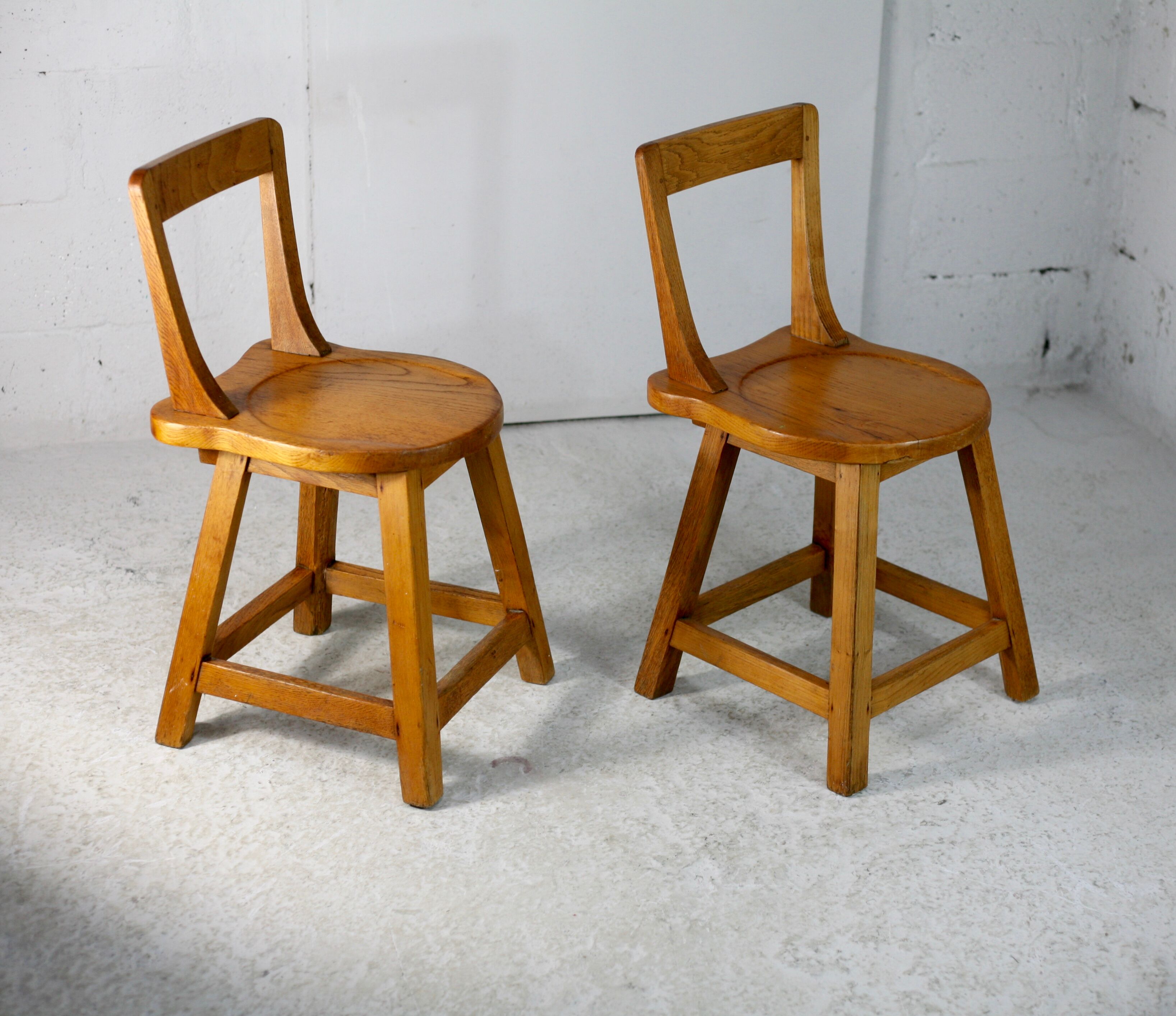 Pair of brutalist wooden back stools. France, circa 1960
