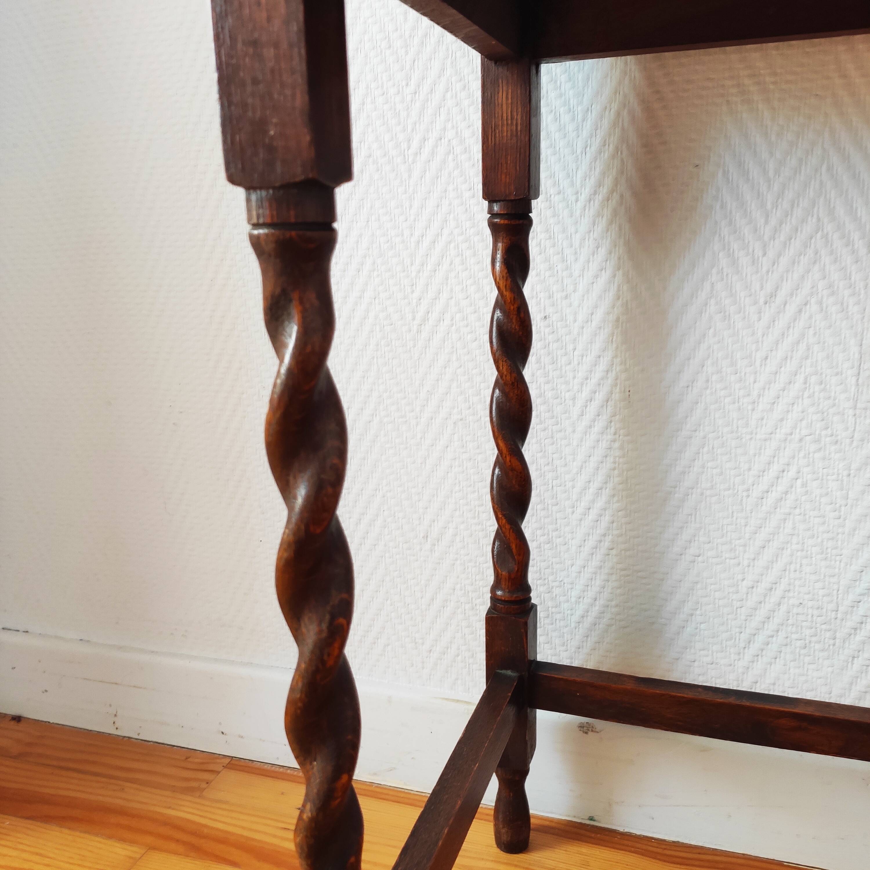 Antique solid oak side table with turned wooden legs.