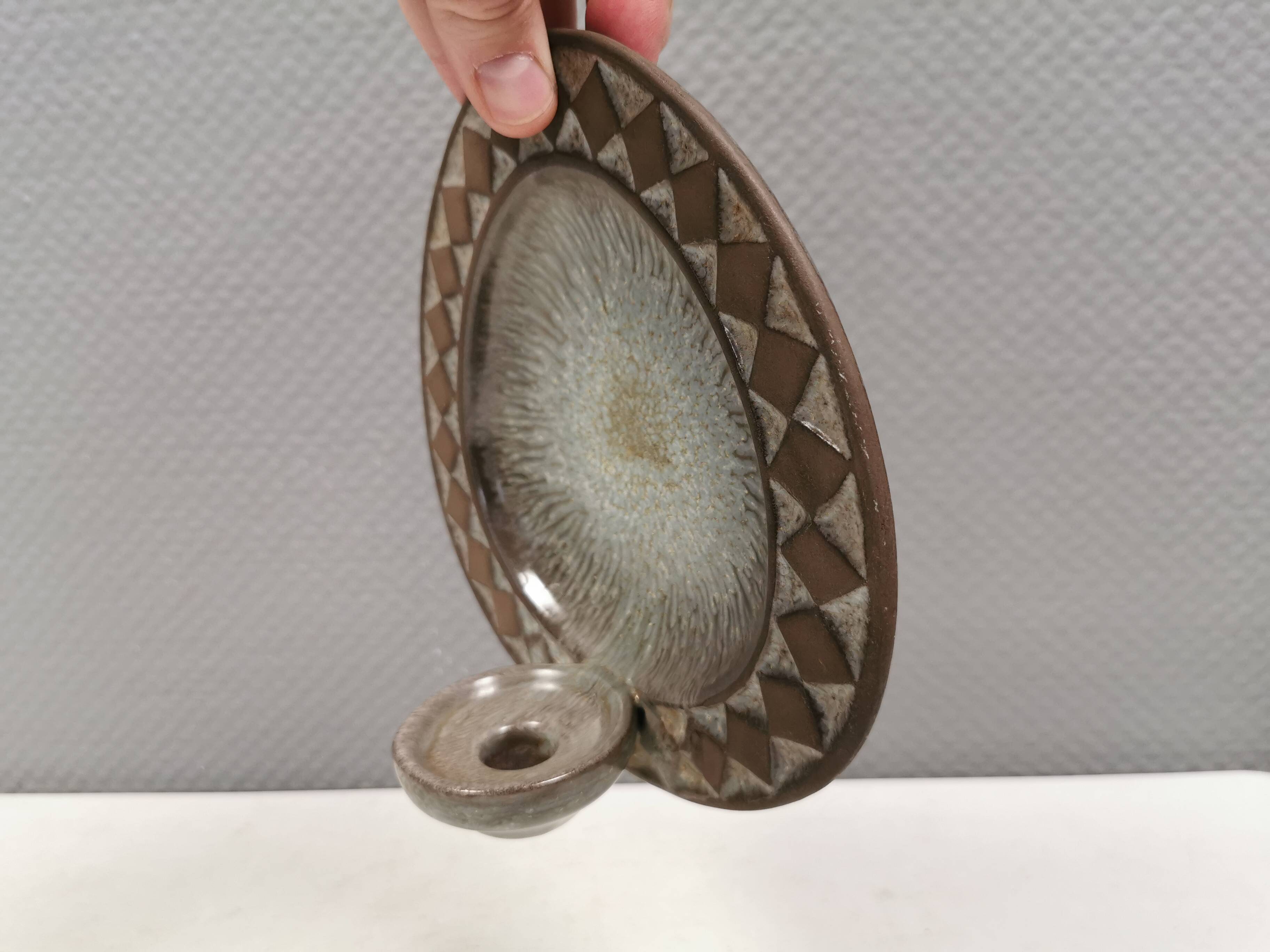 Wall-mounted candlestick in grayish colors, Danish and from the 1970s-80s.