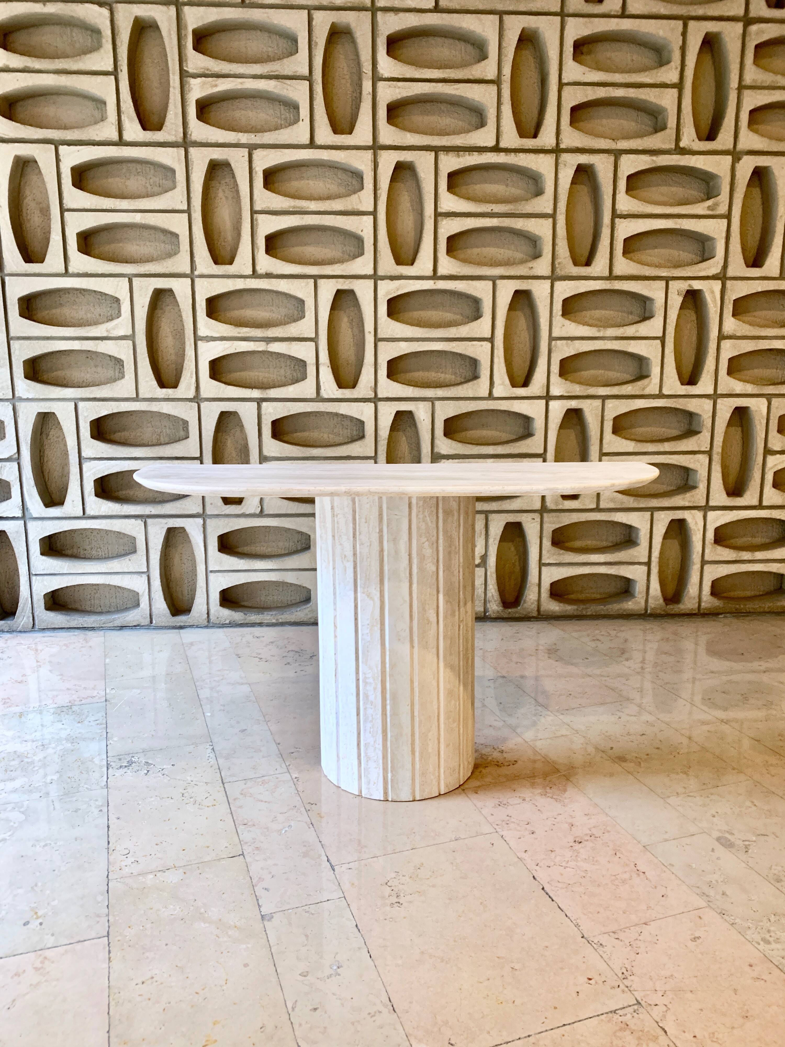 Travertine console with canted foot