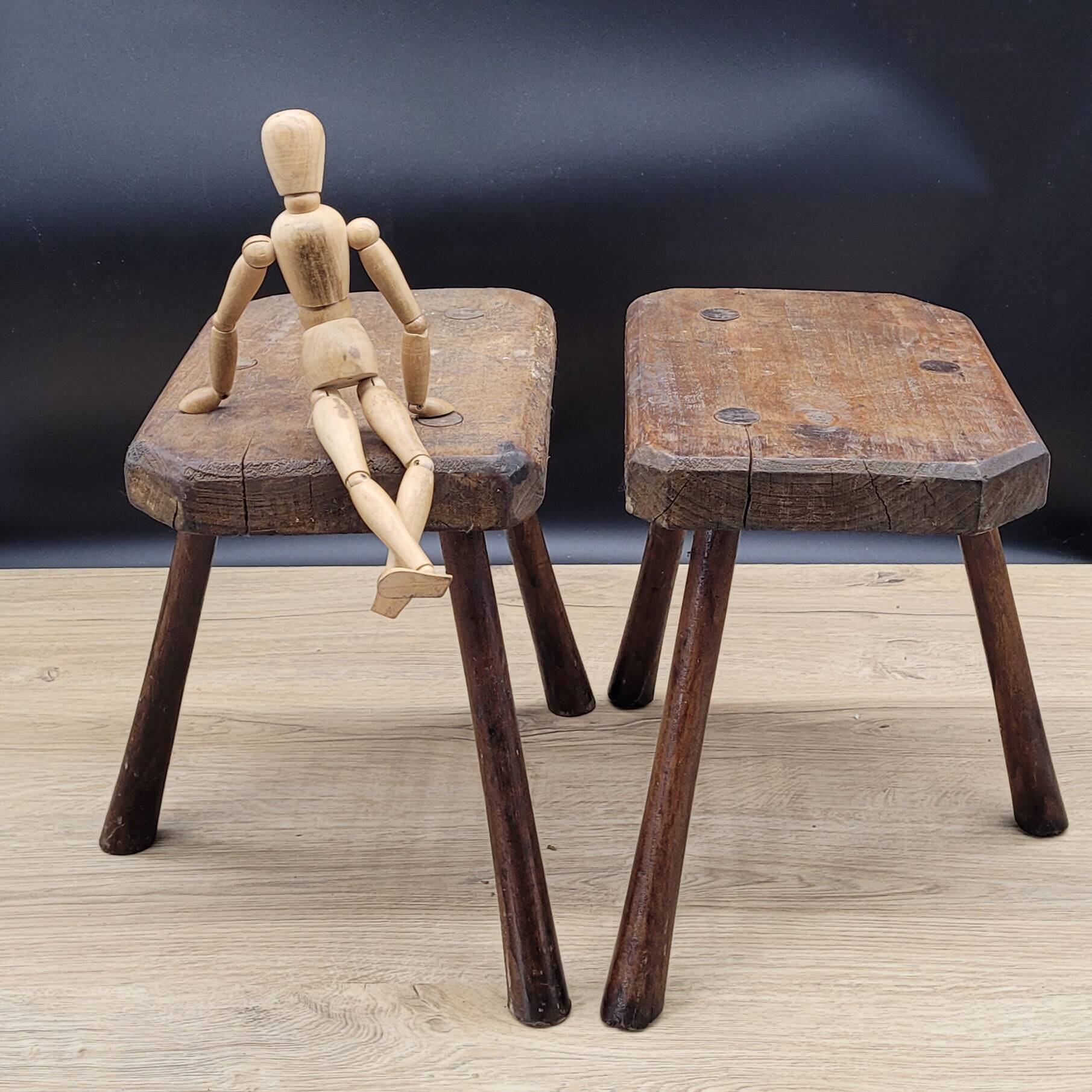 Pair of solid octagon cowhide tripod stools