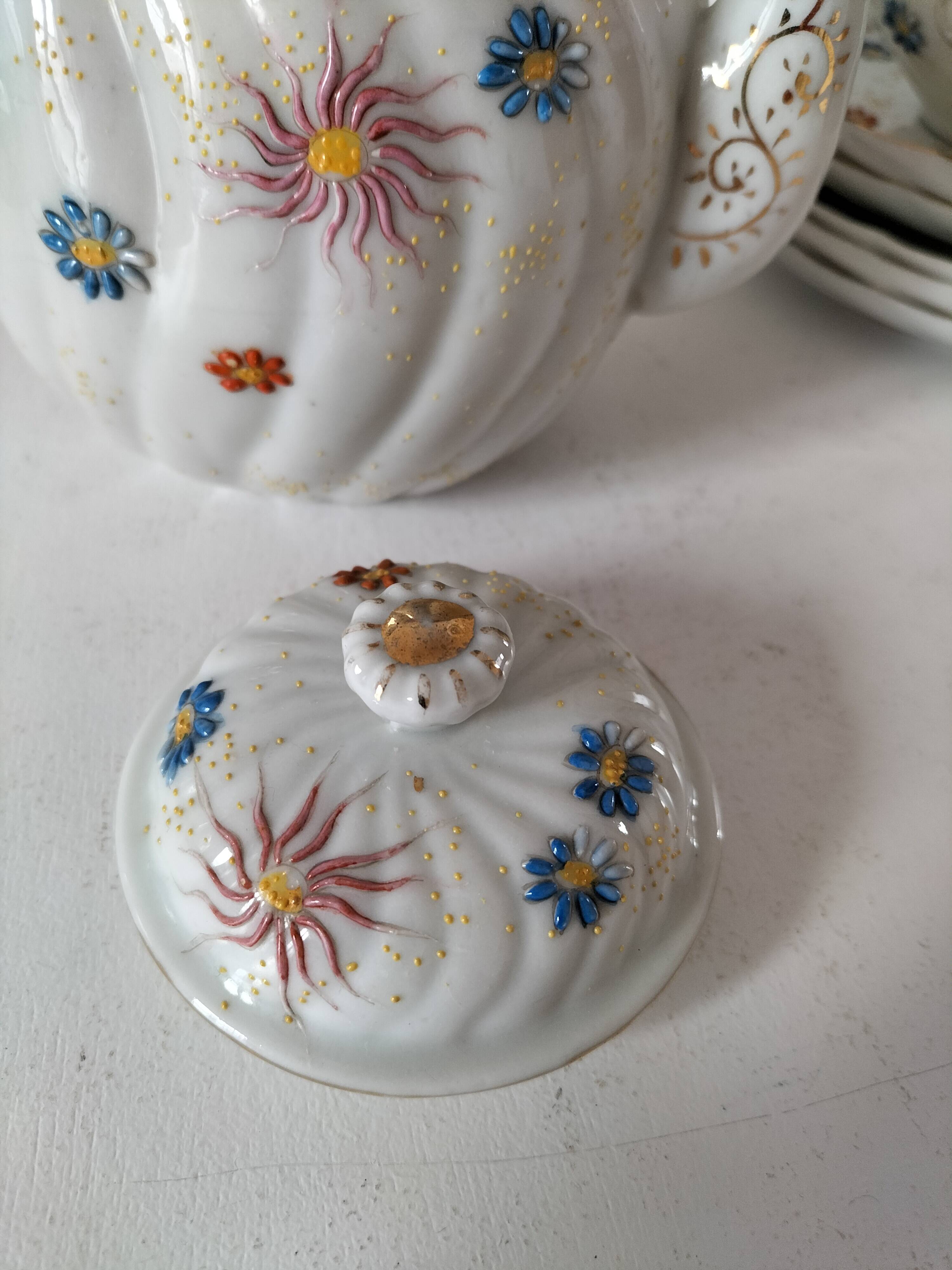 coffee pot, cup and saucers