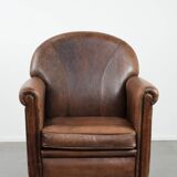 Vintage sheepskin armchair with warm colours and a characterful appearance