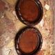 Pair of turned and carved wooden bottle coasters from the 1950s.