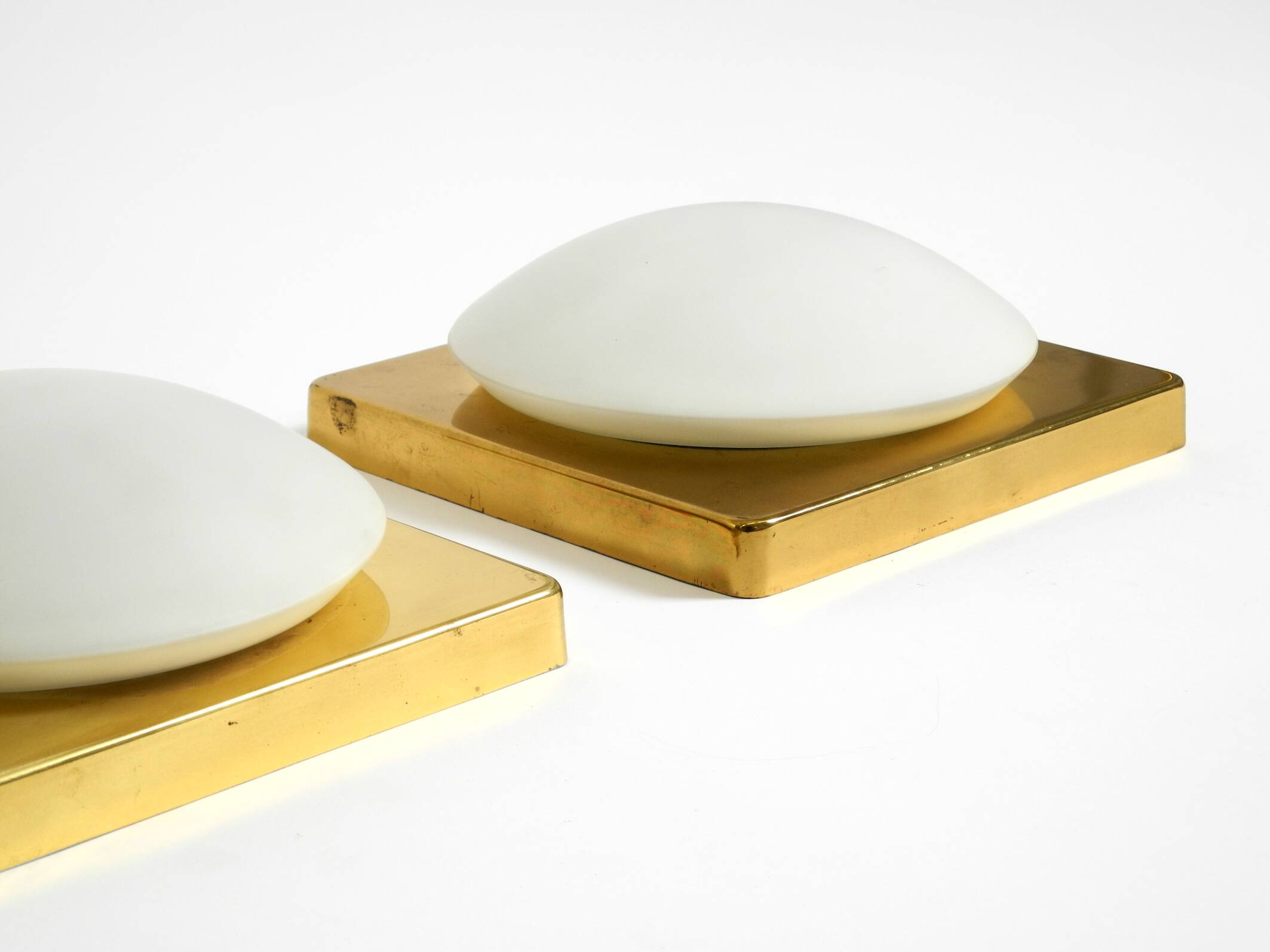 Two 1970s brass wall lamps by Rolf Krüger for Heinz Neuhaus Leuchten