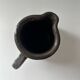 Patinated pitcher signed