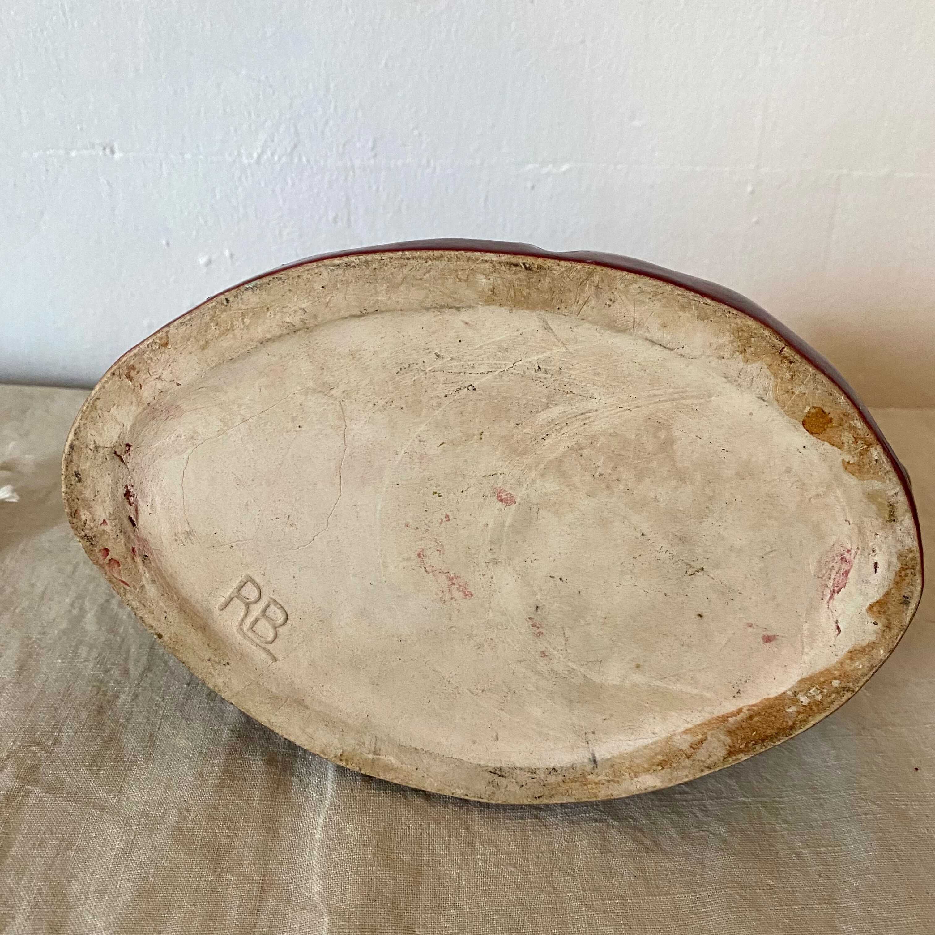 Red ceramic zoomorphic candle holder