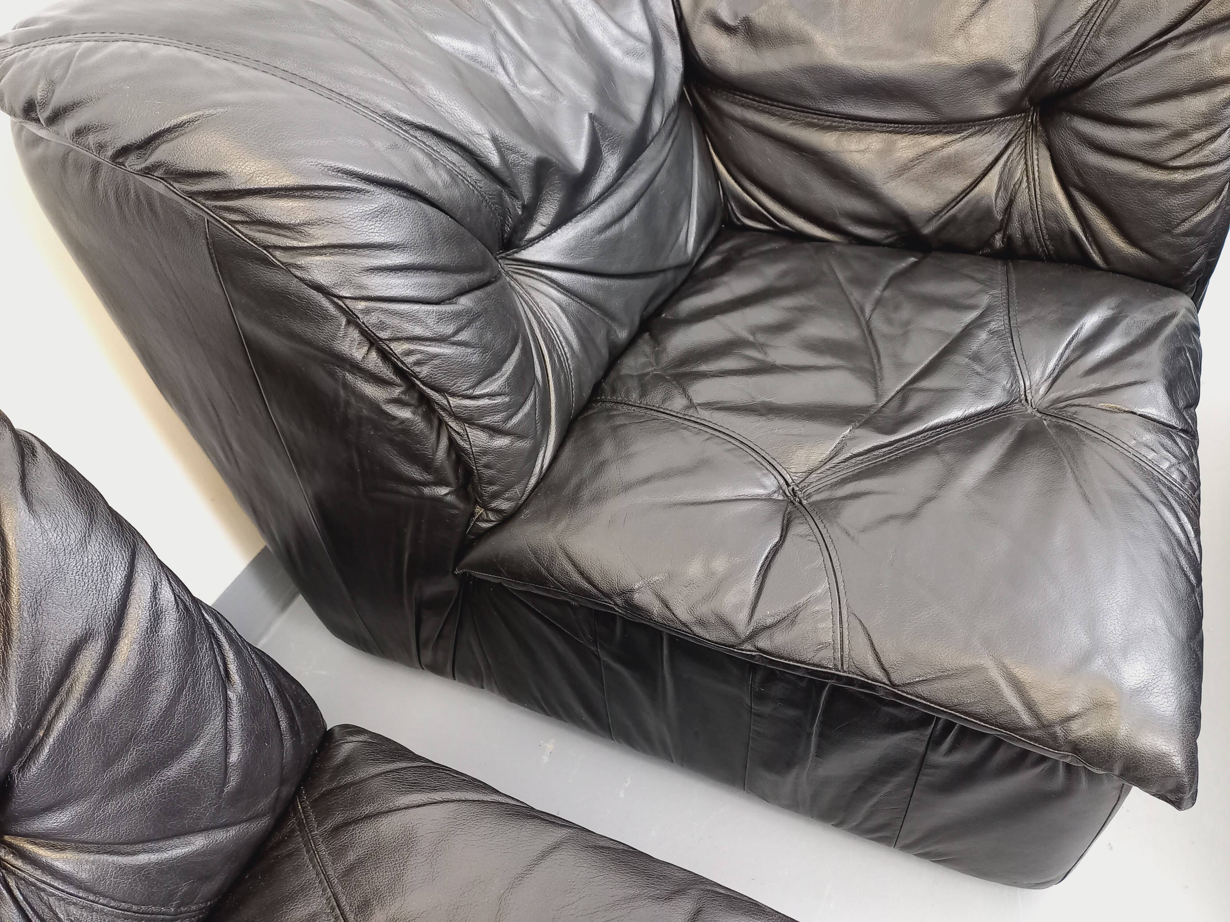 Vintage corner sofa composed of 3 modules in black leather with integrated bed.