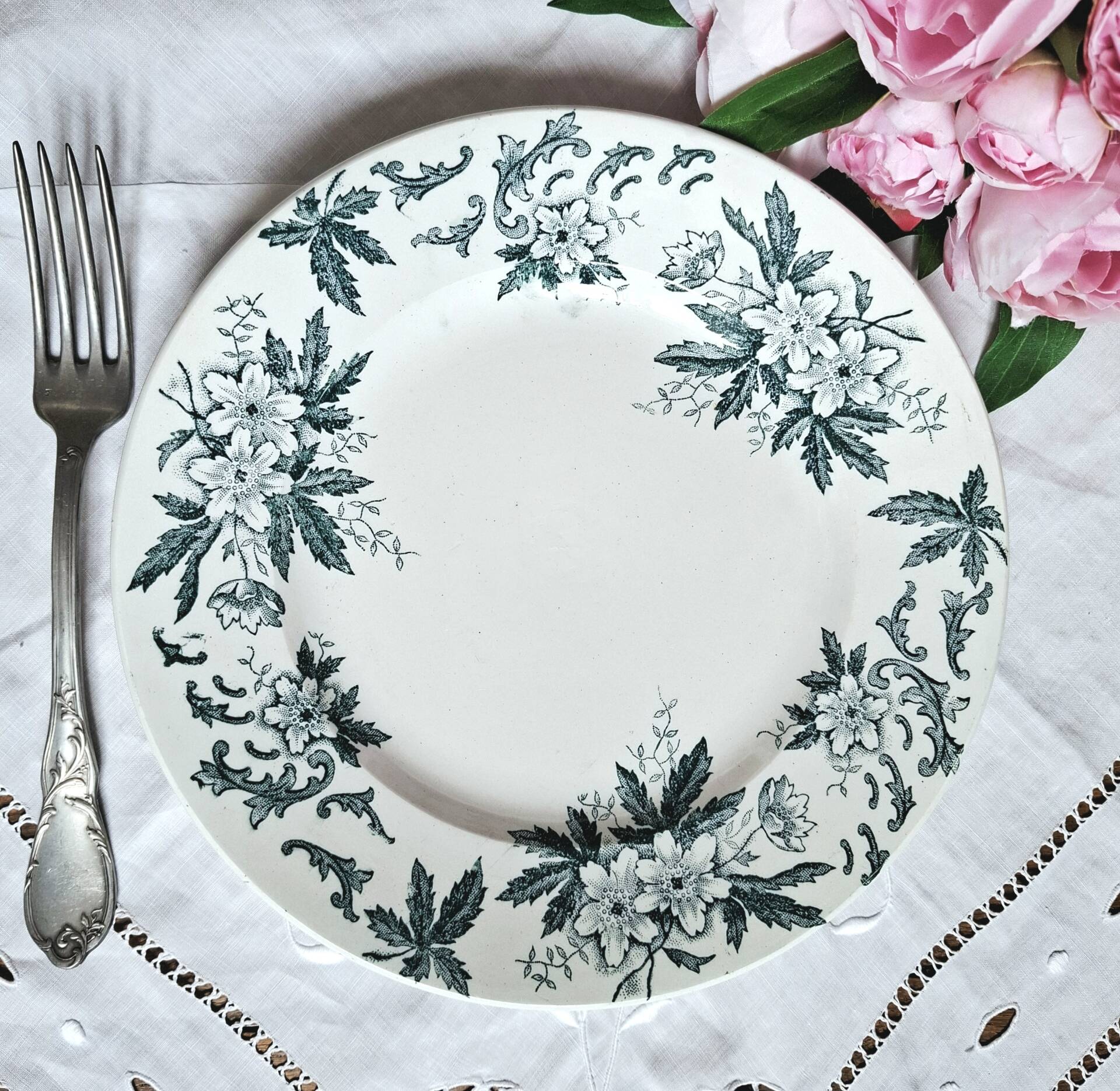 Old mismatched flat plates made of ironstone earthenware.