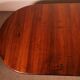 Extensible dining table from the early 19th century in walnut.
