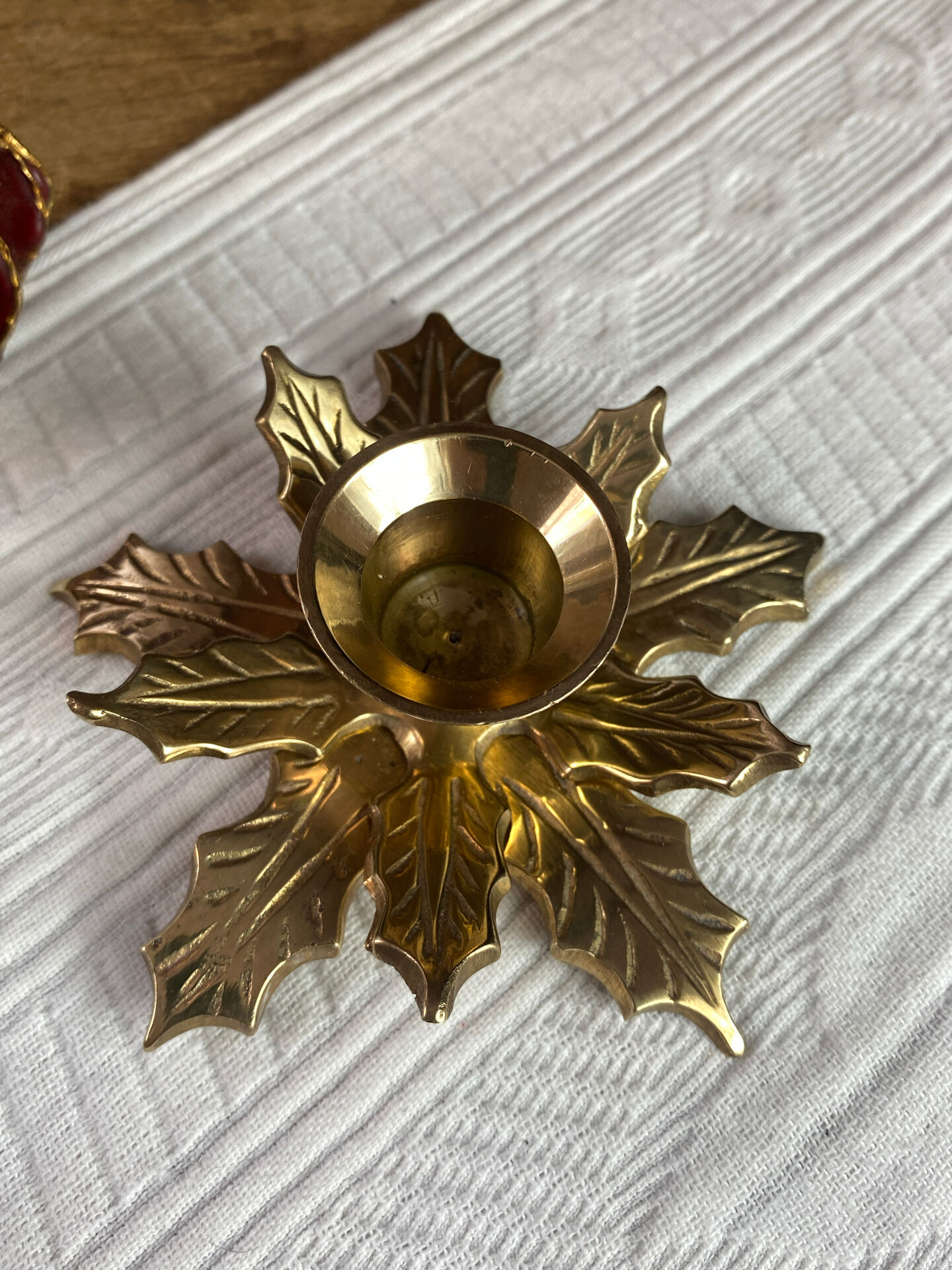 Pair of candlesticks, holly leaves, in brass