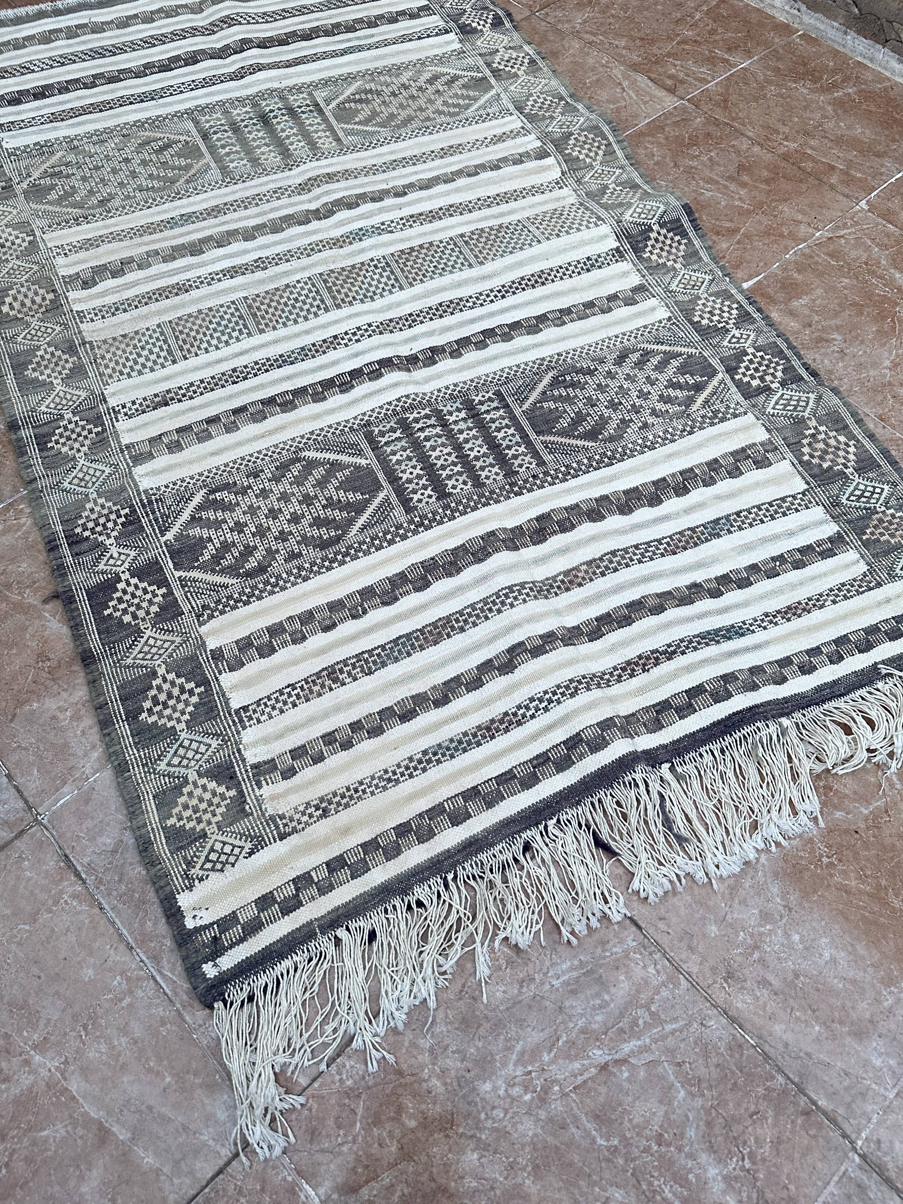 Handwoven Kilim rug made of camel wool, silk, and cactus.