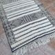 Handwoven Kilim rug made of camel wool, silk, and cactus.