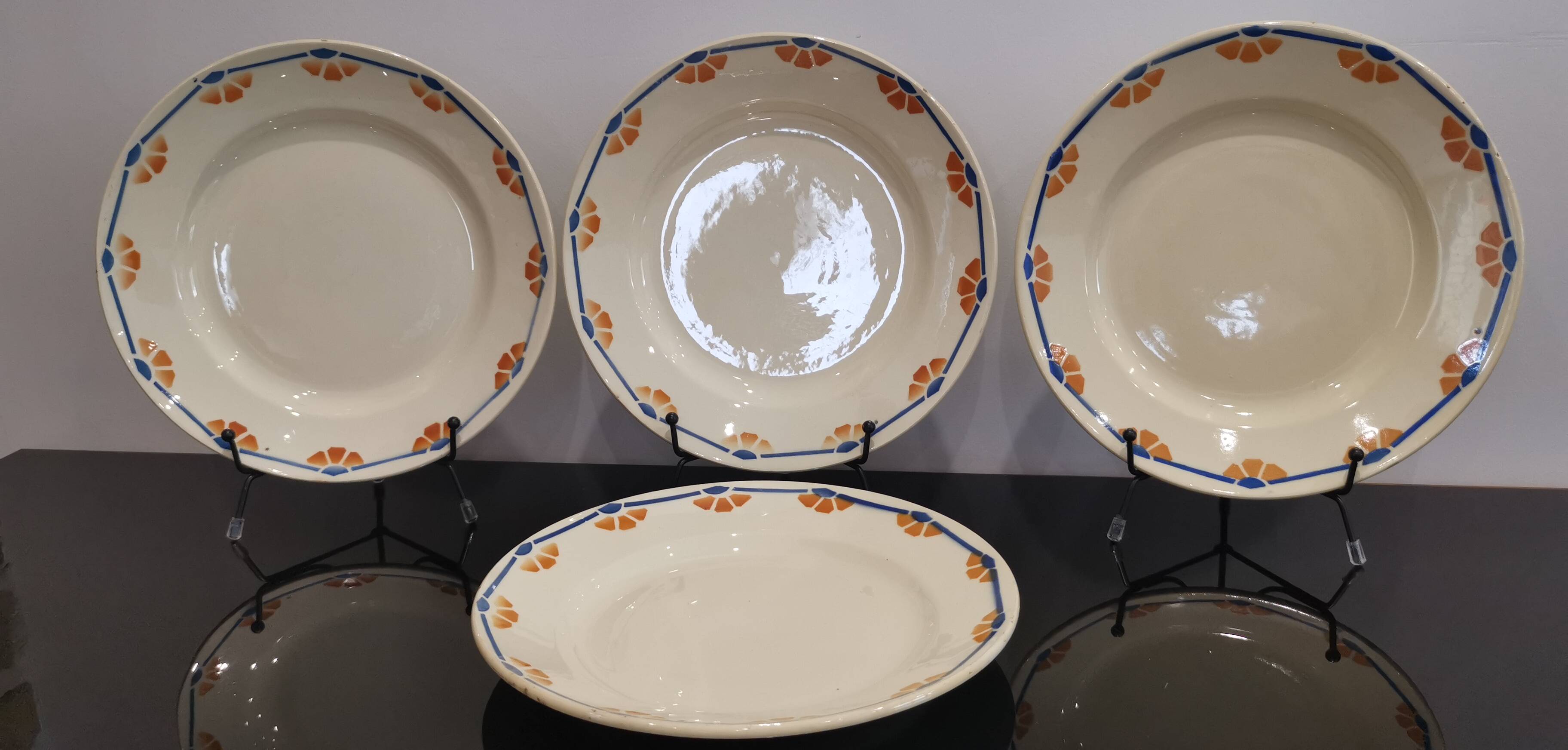 Old semi-deep plates in Terre de fer earthenware