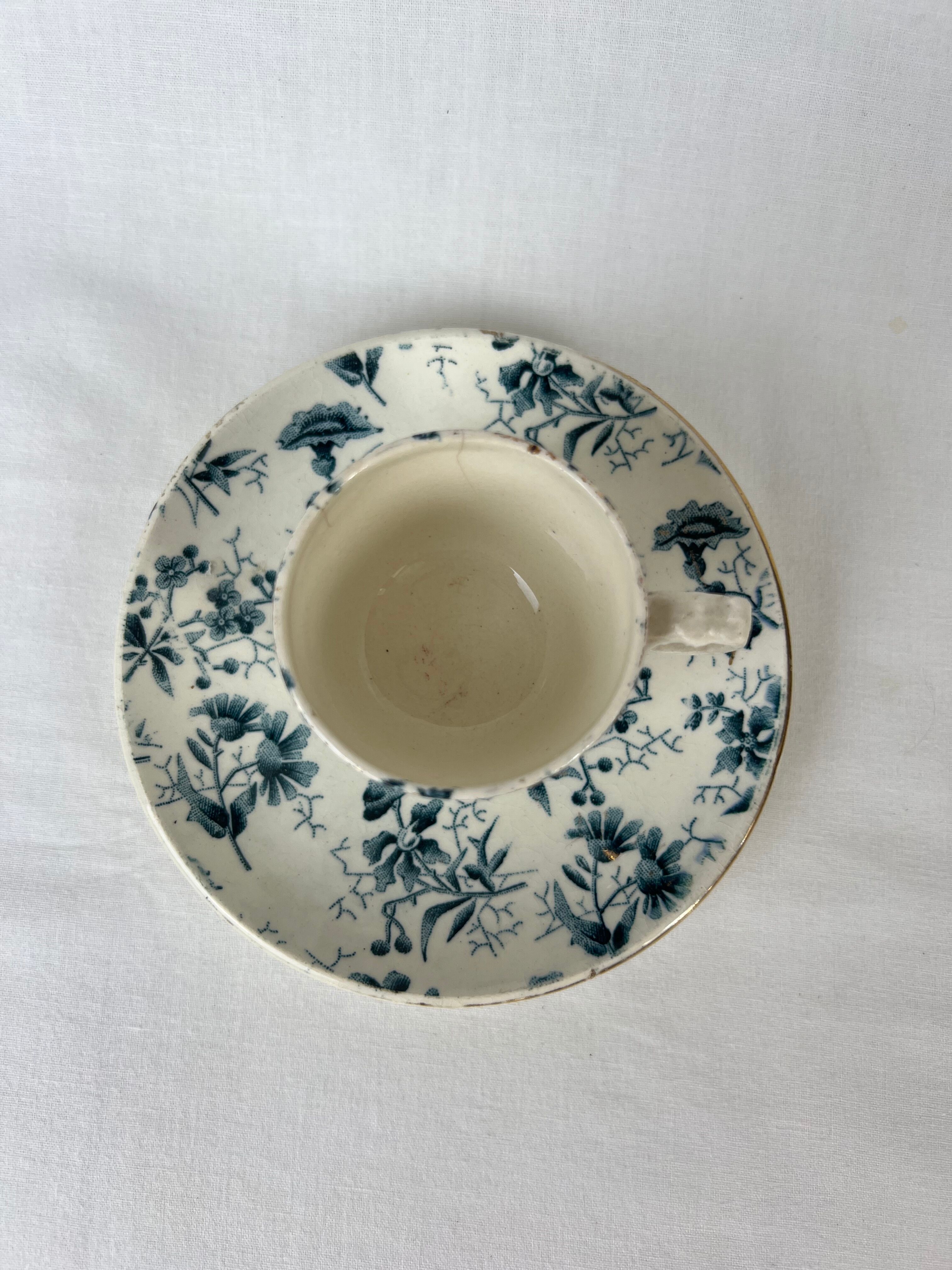 White porcelain cup with blue flowers