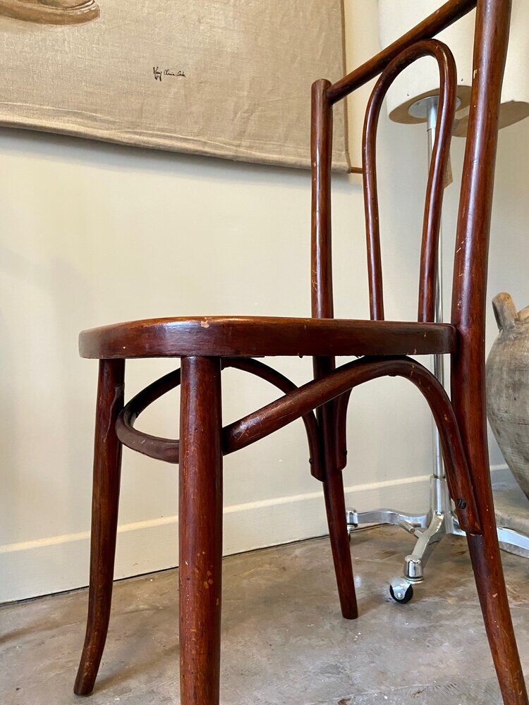 2 bistro chairs in arched and dark wood