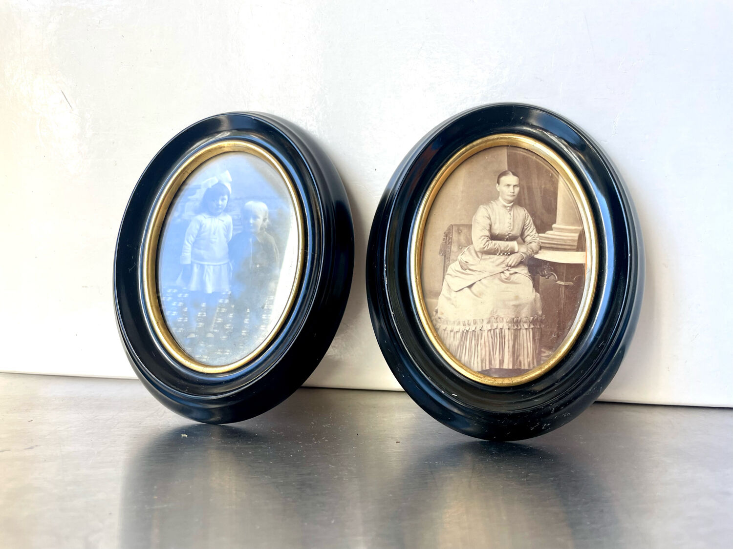 Pair of black wooden oval frames 1880’s  each 13 cm x 10 cm glass measurements 8.5 cm x 5.5 cm